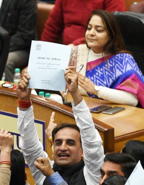 NEW DELHI, INDIA - FEBRUARY 7:  Opposition party councillors protest in front of Delhi Mayor Shelly Oberoi inside the Municipal Corporation of Delhi (MCD) c during the Special Meeting on the Revised Budget Estimates 2023-24, at the Shyama Prasad  clipart