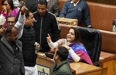 NEW DELHI, INDIA - FEBRUARY 7:  Opposition party councillors protest in front of Delhi Mayor Shelly Oberoi inside the Municipal Corporation of Delhi (MCD) c during the Special Meeting on the Revised Budget Estimates 2023-24, at the Shyama Prasad  clipart