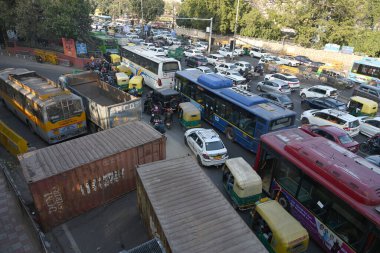 NEW DELHI, INDIA - FEBRUARY 18, 2024: Traffic congestion at ITO due to Delhi Police put barricades as a preventive measure after the Delhi Chalo protest call by farmers, on February 18, 2024 in New Delhi, India. clipart