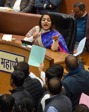 NEW DELHI, INDIA - FEBRUARY 7:  Opposition party councillors protest in front of Delhi Mayor Shelly Oberoi inside the Municipal Corporation of Delhi (MCD) c during the Special Meeting on the Revised Budget Estimates 2023-24, at the Shyama Prasad  clipart