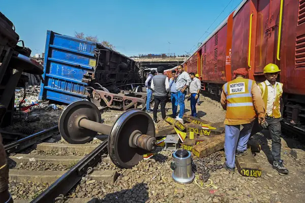 stock image NEW DELHI, INDIA -FEBRUARY 17, 2024: A view of 10 wagons of a goods train derailed on the Patel Nagar-Dayabasti section. The incident happened when the train was passing under the Zakhira flyover on Saturday morning