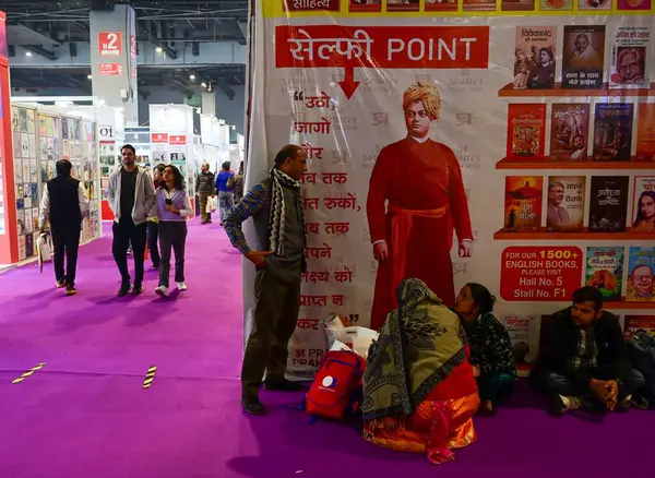 stock image NEW DELHI, INDIA - FEBRUARY 10, 2024: People take rests having refreshment during World Book Fair at Pragati Maidan. This edition of the book fair is spread over 50,000 sq meters and is set to be the biggest book.