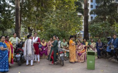 MUMBAI, INDIA - JANUARY 9: Supporters are sitting out side the Shiv Sena UBT group MLA Ravindra Waikar, residence, Jogeshwari during ED searches premises of SS (UBT) MLA Ravindra Waikar over money laundering charges  on January 9, 2024 in Mumbai clipart