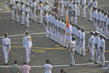 MUMBAI, INDIA - JANUARY 3, 2024: Vice Adm Sanjay. J. Singh inspects the ceremonial parade upon taking over as the FOC-in-C Western Naval Command from Vice Adm Dinesh K Tripathi at INS Shikra, Colaba on January 3, 2024 in Mumbai, India. clipart