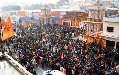 AYODHYA, INDIA - JANUARY 22, 2024: Thousand of devotees came from various part of the country gathered at the main enterence during the consecration ceremony of Shri Ram Janmbhoomi Temple on January 22, 2024 in Ayodhya, India.  clipart