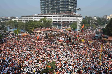 NAVI MUMBAI, INDIA - JANUARY 27, 2024: Huge Crowd gather at Chhatrapati Shivaji Maharaj Chowk Vashi, as Maratha Quota activist Manoj Jarange Patil ends protest after Maharashtra CM Eknath Shinde Government accepts all demands. clipart