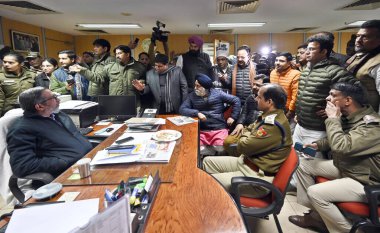 NEW DELHI, INDIA  JANUARY 15: Opposition BJP councilors sit inside MCD Chief Secretary's room during a protest over special meetings to vest the power of standing committee to  House till their formation and to discuss and decide issues relating  clipart