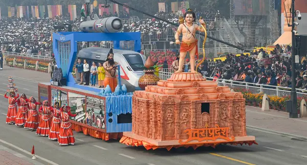 stock image NEW DELHI, INDIA  JANUARY 26, 2024: Artists perform beside the tableaux of Uttar Pradesh state during the 75th Republic Day Parade 2024, at Kartavya Path