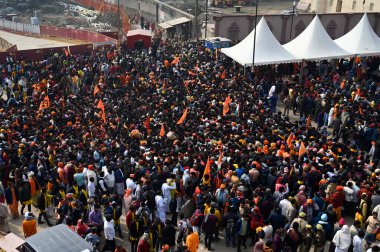 AYODHYA, INDIA - JANUARY 23, 2024: Thousands of devotees gathered for darshan at Ayodhya Ram Janmabhoomi temple, the Police force is having to struggle to control the crowd  on January 23, 2024 in Ayodhya, India. clipart