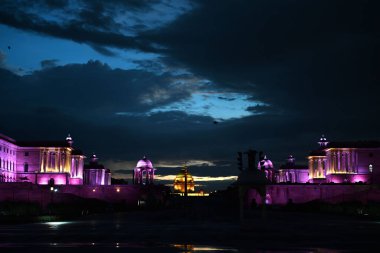 NEW DELHI, INDIA - AUGUST 4, 2024: A cloudy view of South and North block at Vijay Chowk after evening monsoon rain clipart