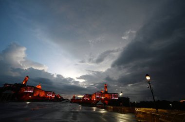 NEW DELHI, INDIA - AUGUST 4, 2024: A cloudy view of South and North block at Vijay Chowk after evening monsoon rain clipart