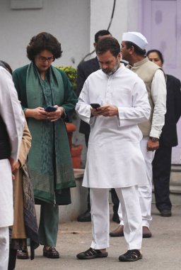 NEW DELHI, INDIA - DECEMBER 28, 2023: Congress General Secretary Priyanka Gandhi Vadra and party leader Rahul Gandhi during the party's 139th Foundation Day celebration, at the party headquarters on December 28, 2023 in New Delhi, India clipart