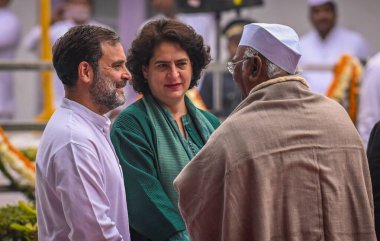 NEW DELHI, INDIA - DECEMBER 28, 2023: Congress President Mallikarjun Kharge with party leaders Rahul Gandhi and Priyanka Gandhi Vadra during the party's Foundation Day function at AICC headquarters on December 28, 2023 in New Delhi, India. clipart