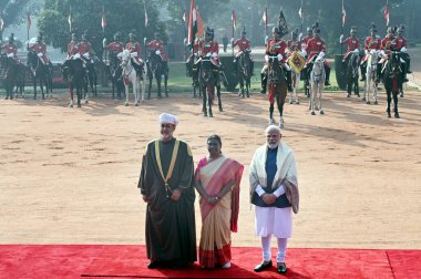 NEW DELHI, INDIA  DECEMBER 16, 2023: President Droupadi Murmu and Prime Minister Narendra Modi with Sultan of Oman Haitham Bin Tariq during the latter's ceremonial reception at the Rashtrapati Bhavan clipart