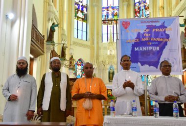 MUMBAI, INDIA  AUGUST 12: Inter-religious prayer meeting for peace and harmony for the Manipur crisis at Byculla Gloria Church, on August 12, 2023 in Mumbai, India.  clipart