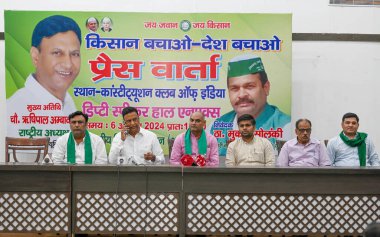 NEW DELHI, INDIA - AUGUST 6:  Rishipal Ambawata, President of Bhartiya Kisan Union (A) along with others addresses a press conference over various issues of farmers at Constitution Club   on August 6, 2024 in New Delhi, India.  clipart