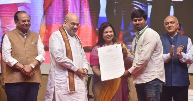 NEW DELHI, INDIA  MAY 3: Union Home  Minister Amit Shah, Delhi LG Vinai Kumar Saxena and MOS for External Affairs Meenakshi Lekhi during the present the appointment letters to a NDMC staff,  at Talkatora Indoor Stadium, on May 3, 2023 in New Delhi clipart