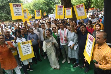 NEW DELHI, INDIA - AUGUST 8:  Delhi University teachers sit on dharna at Jantar Mantar for their demands including privatization of education, implementation of old pension scheme, creation of posts of teachers after increasing EWS reservation    clipart