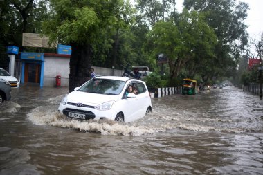 NEW DELHI, INDIA - JULY 8: After heavy monsoon rainfall waterlogged at Shaheen Bagh, on July 8, 2023 in New Delhi, India. Delhi-NCR was drenched with heavy rain on the intervening night of Friday and Saturday.  clipart