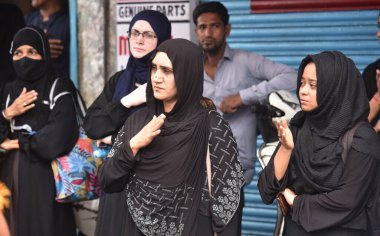 NEW DELHI, INDIA - JULY 29, 2024: Muslim devotees take part in a mourning procession marking the day of Ashura, 10 Muharram-ul-Haram, at Shia Jama Masjid Kashmiri Gate, on July 29, 2023 in New Delhi, India. Ashura mourns the death of Imam Hussein. clipart