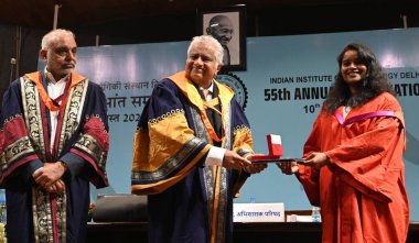 NEW DELHI, INDIA - AUGUST 10: Newly Graduated students from IIT Delhi receives their degrees by Harish Salve, King's Counsel and Sr. Advocate Chairperson Broad of Governors IIT Delhi, and Founder and Co-Chairman, Jubilant Bhartia Group  clipart