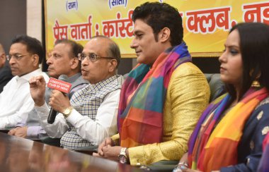 NEW DELHI, INDIA  JULY 2: Chairman of the committee, Luv-Kush Ramlila Committee  Arjun Kumar and other members along with  Bollywood Star Gagan Malik (Playing Ram), Songwriter, Singer, film actress Sweety as (Sita)   clipart