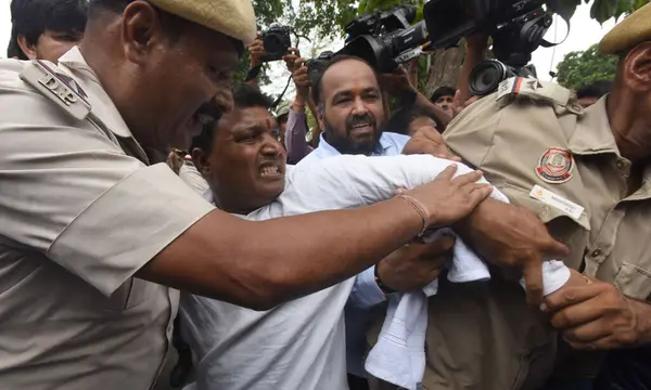 stock image NEW DELHI, INDIA - JULY 3: Police personal details Indian Youth Congress activists protesting  demanding the resignation of the Chief Minister of Manipur at Near Shastri Bhavan on July 3, 2023 in New Delhi, India. 