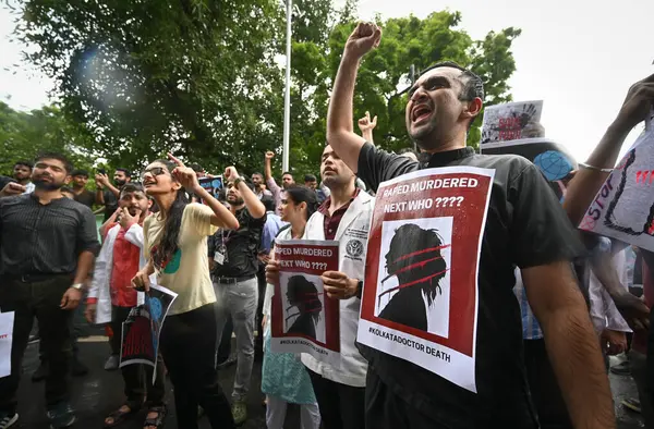 stock image NEW DELHI, INDIA - AUGUST 13: Doctors from AIIMS Delhi stage a protest against the alleged Kolkata Doctor Rape case on August 13, 2024 in New Delhi, India. 