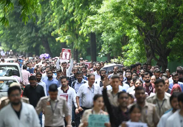 stock image NEW DELHI, INDIA - AUGUST 13: Doctors from AIIMS Delhi stage a protest against the alleged Kolkata Doctor Rape case on August 13, 2024 in New Delhi, India. 