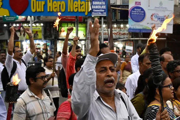 stock image KOLKATA, INDIA - AUGUST 13: Members of different organizations take out a protest rally in solidarity with agitating doctors over the rape and murder of a PGT woman doctor on August 13, 2024 in Kolkata, India. (Photo by Samir Jana/Hindustan Times)