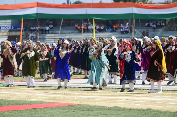 stock image SRINAGAR, INDIA - AUGUST 13: School students in traditional Kashmiri attire perform during full dress rehearsal ahead of independence day at Bakshi Stadium on August 13, 2024 in Srinagar, India. ( Photo by Waseem Andrabi/Hindustan Times)