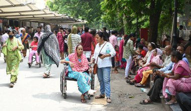 NEW DELHI, INDIA - AUGUST 14, 2024: Patient crowded out side OPD due to RML hospital doctors and staff members site dharna for their demanding CPA, at RML Hospiatl on August 14, 2024 in New Delhi, India.  clipart