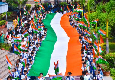 NEW DELHI, INDIA - AUGUST 14, 2024: Students of Vidya Bal Bhavan participate in Tranga Yatra, The tricolor rally with 100 feet tricolor, On the occasion of Independence Day, at Vidya Bal Bhawan Senior Secondary School. clipart