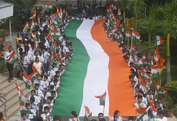 stock image NEW DELHI, INDIA - AUGUST 14, 2024: Students of Vidya Bal Bhavan participate in Tranga Yatra, The tricolor rally with 100 feet tricolor, On the occasion of Independence Day, at Vidya Bal Bhawan Senior Secondary School.