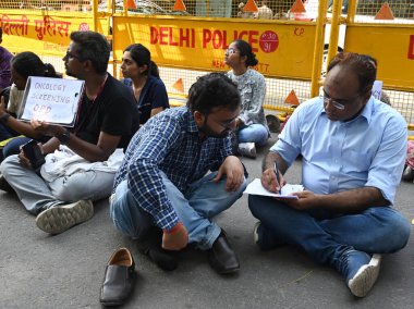 A doctor gives a treatment to patient during the Resident Resident Doctors protesting in front of Health Ministry HQ Nirman Bhawan Main Road, demanding justice for the victim of Kolkatas RG Kar Hospital Tragedy, and demanding CPA, on August 19, 2024 clipart