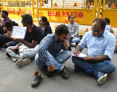 A doctor gives a treatment to patient during the Resident Resident Doctors protesting in front of Health Ministry HQ Nirman Bhawan Main Road, demanding justice for the victim of Kolkatas RG Kar Hospital Tragedy, and demanding CPA, on August 19, 2024 clipart