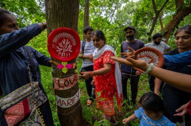 Nature lovers in Mumbai celebrated Raksha Bandhan by tying rakhis to trees in Aarey Colony, on August 17, 2024 in Mumbai, India. clipart