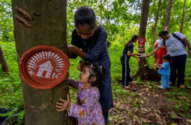 Nature lovers in Mumbai celebrated Raksha Bandhan by tying rakhis to trees in Aarey Colony, on August 17, 2024 in Mumbai, India. clipart