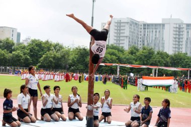 Girls of Bhagwati Arsh Kanya Gurukul perform Mallakhamb during 78th Independence Day celebrations at Tau Devi Lal Stadium in sector-38 near Rajiv chowk, on August 15, 2024 in Gurugram, India. clipart