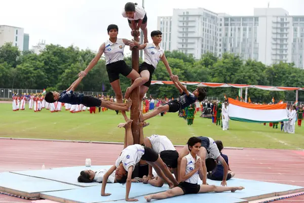 stock image Girls of Bhagwati Arsh Kanya Gurukul perform Mallakhamb during 78th Independence Day celebrations at Tau Devi Lal Stadium in sector-38 near Rajiv chowk, on August 15, 2024 in Gurugram, India.