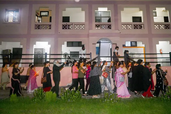 stock image Members of the Noida Bengali Cultural Association (NBCA) staged a candlelight protest at Noida Kali Bari Sector 26 on Wednesday night against alleged sexual assault and murder of  intern doctor at Kolkatas RG Kar Medical College, on August 15, 2024