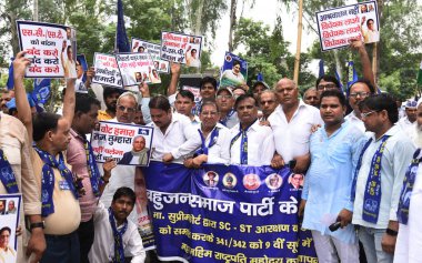 GHAZIABAD, INDIA - AUGUST 21: BSP workers take out protest march during  Bharat Bandh against the Supreme Court's decision on creamy layer in Scheduled Caste and Scheduled Tribe reservation on hapur road dm office  on August 21, 2024 in Ghaziabad clipart