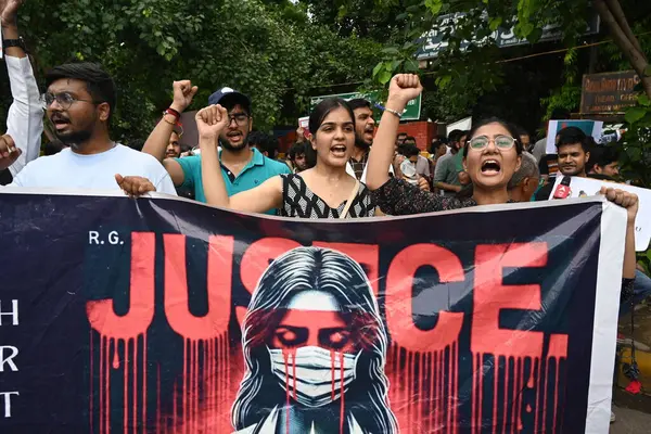 stock image NEW DELHI, INDIA - AUGUST 21: Practicing doctors and medical staff display placards as they take part in a protest against the incident of rape and murder of a young medic in Kolkata, during a demonstration held at Jantar Mantar  on August 21, 2024 