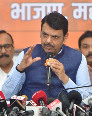 MUMBAI, INDIA - JUNE 5: Maharashtra Deputy CM Devendra Fadnavis along with BJP leaders addressing the media at BJP office on June 5 ,2024 in Mumbai, India. BJP leader Devendra Fadnavis offered to resign as Maharashtra Deputy Chief Minister  clipart