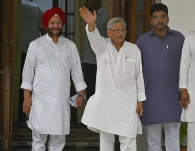 NEW DELHI INDIA - JUNE 1: Communist Party of India (Marxist) (CPI-M) General Secretary Sitaram Yechury and Congress leader Gurdeep Singh Sappal at the residence of Congress National President Mallikarjun Kharge to attend the INDIA Bloc meeting at Raj clipart