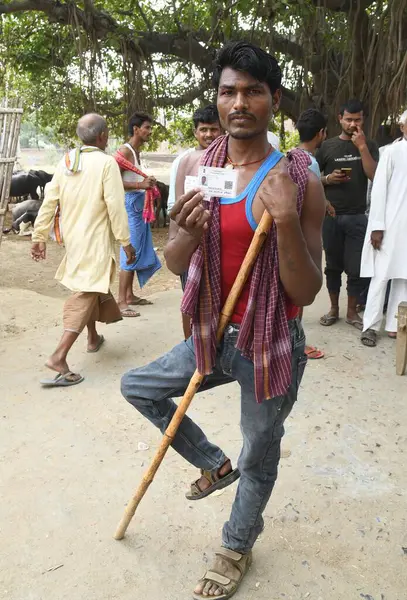 stock image PATNA INDIA - JUNE 1: A disable voter showing voter ID cards after cast vote at a polling booth during seventh and last phase of Lok Sabha election at Danapur Diyara on June 1 2024 in Patna India. (Photo by Santosh Kumar/Hindustan Times )