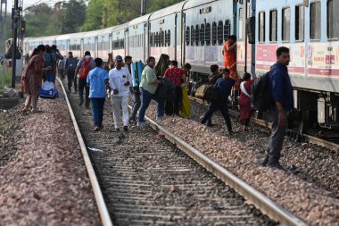 NEW DELHI  INDIA - JUNE 3  2024  Firefighters and passengers on tracks after a fire broke out in the Taj Express  near Sarita Vihar  on June 3  2024 in New Delhi  India. The blaze broke out between the Okhla and Tughlakabad railway stations. The trai clipart