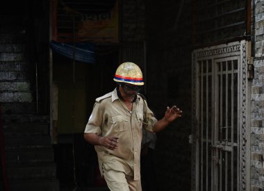 NOIDA  INDIA - JUNE 3  2024  Fire brigade personnel extinguish the fire at a garment factory in Sector 10  on June 3  2024 in Noida  India. During the investigation  it came to light that the fire broke out due to a short-circuit in the AC  and later clipart