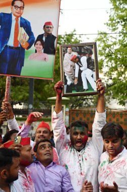 LUCKNOW  INDIA - JUNE 4  2024  Samajwadi party workers celebrate at SP office after India Alliance leads in Lok Sabha election 2024  on June 4  2024 in Lucknow  India. In Uttar Pradesh  Akhilesh Yadav Samajwadi Party has thrown up a big surprise as i clipart