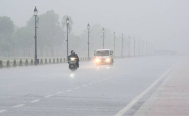 NEW DELHI INDIA JUNE 27 2024 A view heavy rain at near the India Gate on June 27 2024 in New Delhi India The India Meteorological Department IMD has predicted the arrival of monsoon over large parts of northwest India over the next three to four days clipart